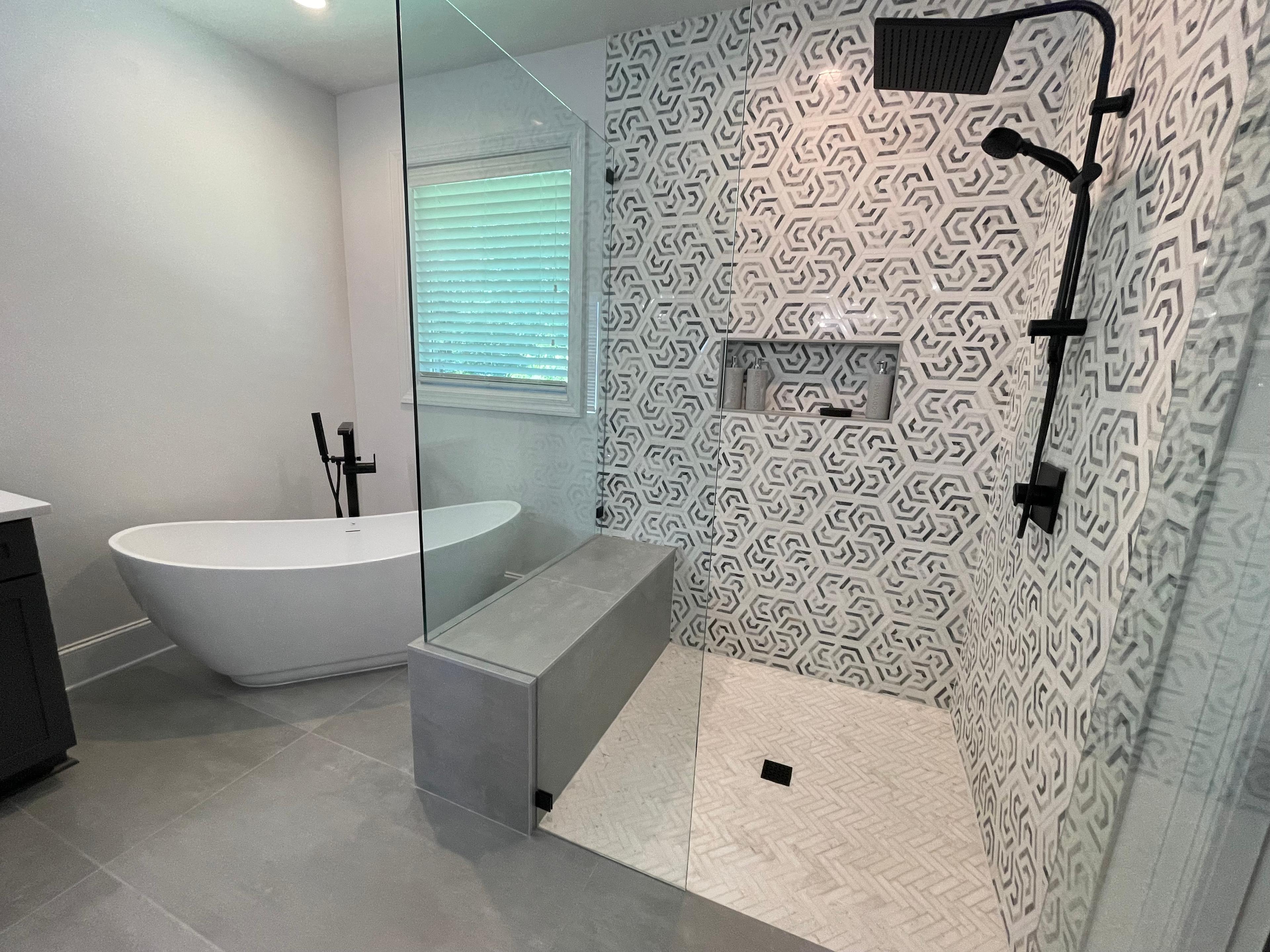 Marble shower with niche and glass enclosure